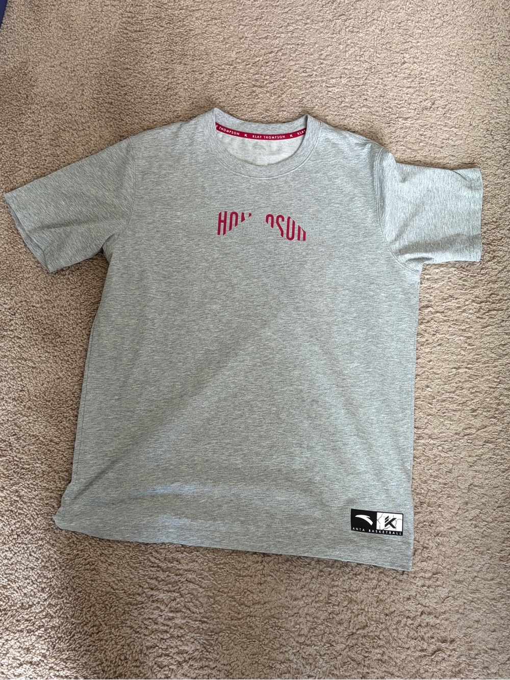 Anta Klay Thompson Grey Short Sleeve Tee with Red Chest Logo